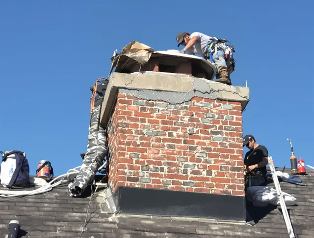 Bonita Springs Chimney Sweep installing a custom chimney crown in Bonita Springs, FL
