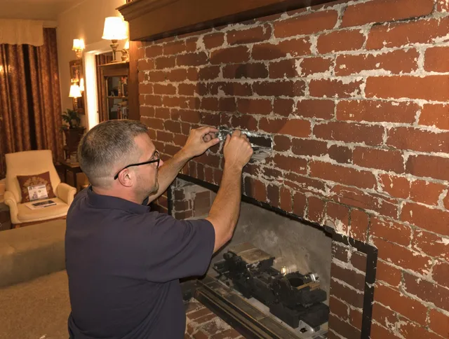 Bonita Springs Chimney Sweep expert fixing a fireplace in Bonita Springs, FL